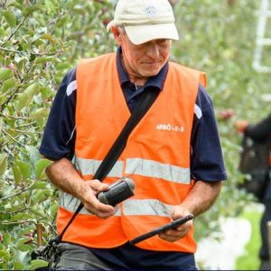 Orchard supervisor with portable printer and tablet - Fairfield Orchards